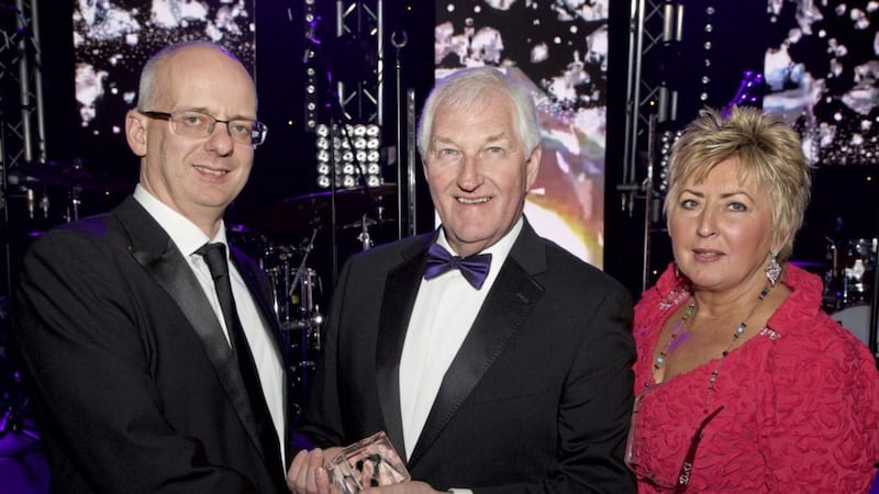 Publishers James and Gladys Greer receive the Hall of Fame award from GroceryAid chief executive Steve Barnes (left) in recognition of their years of service to the charity through Ulster Grocer magazine 