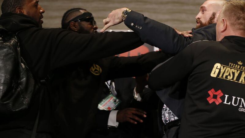 <span style="font-family: Arial, Verdana, sans-serif; ">Boxers Deontay Wilder (left) and Tyson Fury had to be separated as things got hot at a news conference in Los Angeles</span>