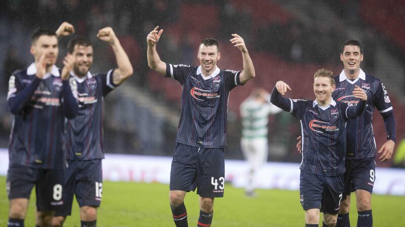 Ross County's Paul Quinn (centre) and his team-mates celebrate their victory over Celtic in the Scottish League Cup semi-final at Hampden Park<br />Picture by PA&nbsp;