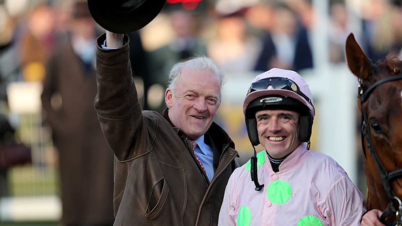 Jockey Ruby Walsh celebrates with trainer Willie Mullins after riding Limini to victory in the Trull House Stud Mares' Novices' Hurdle during St Patrick's Thursday of the Cheltenham Festival<br />Picture by PA