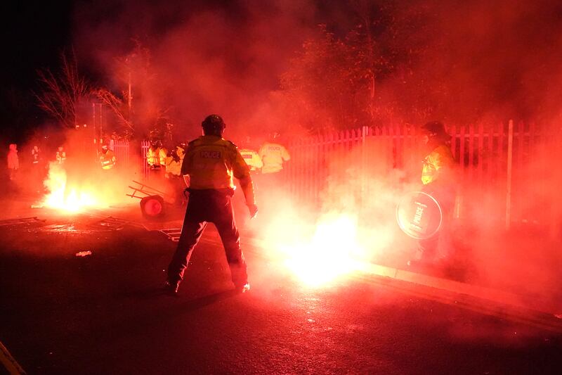 Police attempt to put out flares on November 30