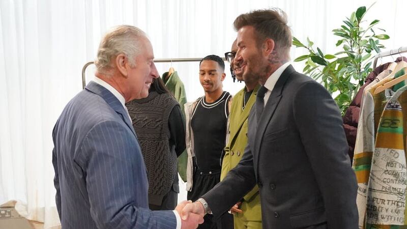 Charles shakes the hand of David Beckham (Jonathan Brady/PA)