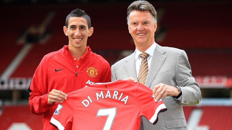 Angel Di Maria, pictured left with Louis van Gaal, completed his ill-fated move to Manchester United on August 26, 2014 (Peter Byrne/PA)