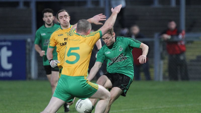<address>Ballyholland&rsquo;s Damien Campbell attempts to block a shot from Castlewellan&rsquo;s Cathal Crilly at P&aacute;irc Esler on Sunday night<br/>Picture: Colm O&rsquo;Reilly