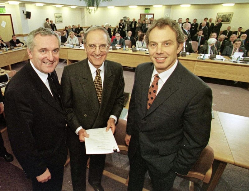 File photo dated 10/04/98 of former Prime Minister Tony Blair (right) former US Senator George Mitchell (centre) and former Irish Prime Minister Bertie Ahern (left) smiling after they signed the historic agreement for peace in Northern Ireland. PRESS ASSOCIATION Photo. Issue date: Wednesday April 10 2013. The Prime Minister has led tributes to the architects of the Good Friday Agreement in Northern Ireland on its 15th anniversary. David Cameron said the 1998 political accord which brought about devolved governance from Stormont after the IRA and loyalist paramilitaries declared ceasefires heralded a new beginning after decades of division and terrorism. See PA story ULSTER Agreement. Photo credit should read: PA Wire 