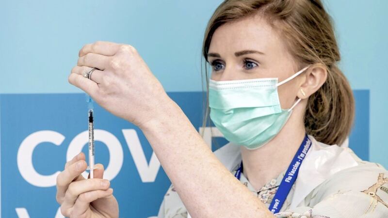 From All-Ireland winner to vaccinator, Public Health Nurse and former Dublin player Karen Kennedy readies a vaccine for delivery.<br /> Pic: Marc O'Sullivan