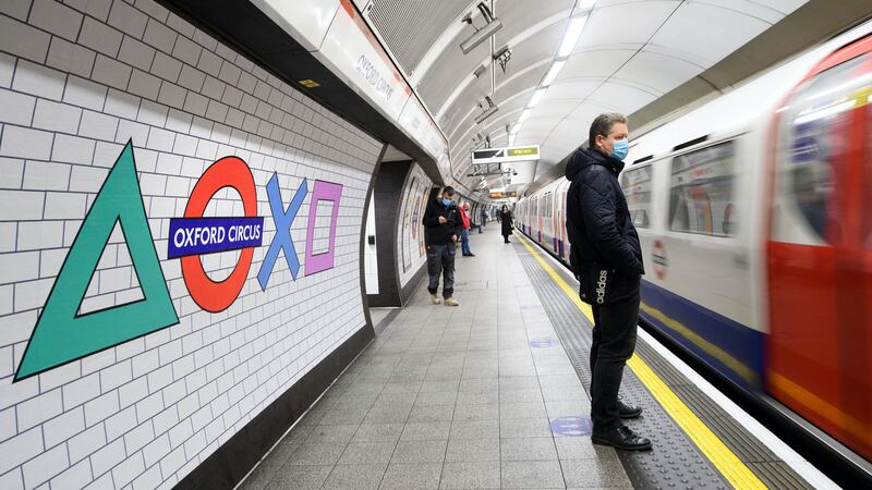 The roundel Underground signs have been reimagined as the PlayStation shapes.