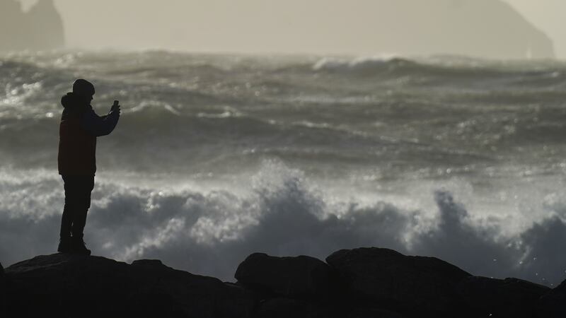 A person watching high waves earlier in December