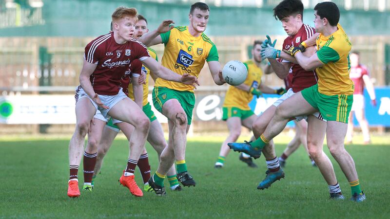 Donegal's Leo McLoone and Stephen McBrearty with Peter Cooke and Sean Kelly of Galway during Sunday's Division One match at O'Donnell Park, Letterkenny Picture by Margaret McLaughlin
