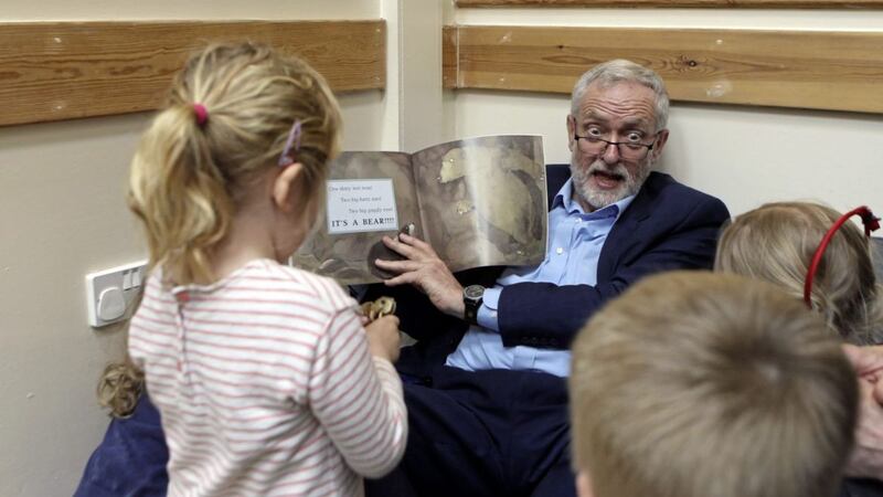 Labour leader Jeremy Corbyn reads with children as he visits Brentry Children Centre in Bristol Picture Steve Parsons/PA 