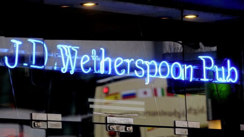 Pubs chain Wetherspoon says it sales have been slowing and it is now facing &quot;substantially higher&quot; costs 