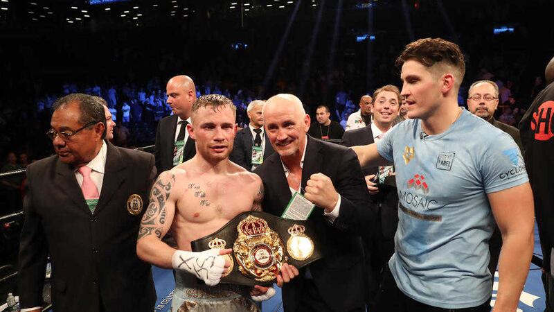 Carl Frampton celebrates with Barry McGuigan and Shane McGuigan after defeating Leo Santa Cruz. Picture by William Cherry/ Press Eye  