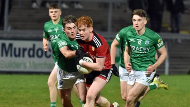 Paudie Clancy of Down is challenged by Fermanagh's Oisin Murphy during the Ulster U20 Football Championship preliminary round match at Pairc Esler on Friday night                Picture: Brendan Monaghan&nbsp;