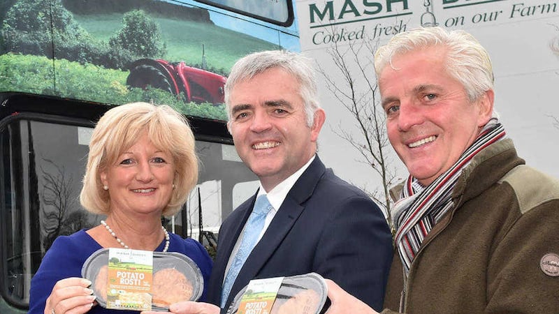 Enterprise minister Jonathan Bell with Tracy and Martin Hamilton at Mash Direct in Comber 