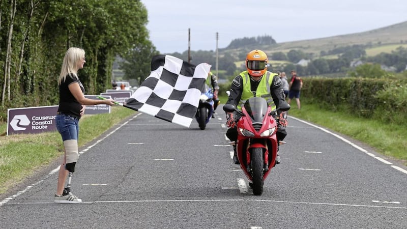 Paramedic Allister MacSorley completes a lap of the circuit at Armoy Races, a year after a collision at the event that left him paralysed. Picture by Stephen Davison 