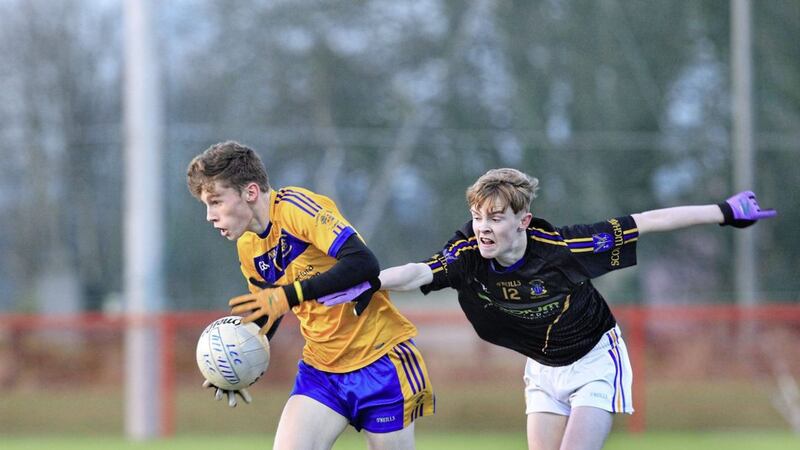 Loreto, Coleraine&#39;s Fearghal Close with Liam McCann of St Louis, Ballymena during the MacLarnon Cup quarter-final at Owenbeg Picture Margaret McLaughlin 