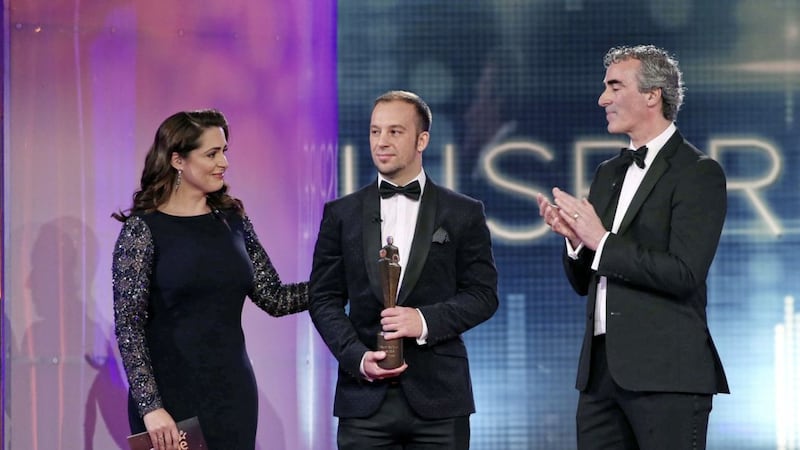Buncrana tragedy hero Davitt Walsh, pictured on stage with Grainne Seoige as he received his People of the Year Award presented by Jim McGuinness 