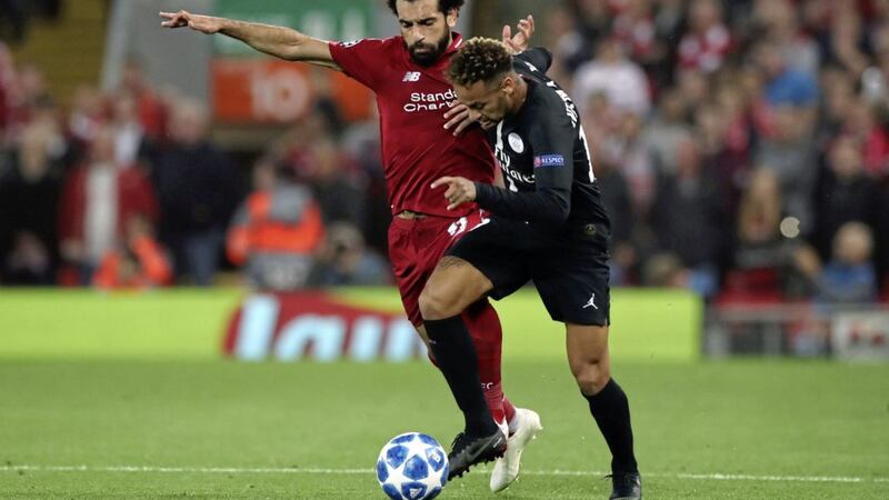 Liverpool&#39;s Mohamed Salah (left) and Paris Saint-Germain&#39;s Neymar battle for the ball during the UEFA Champions League, Group C match at Anfield. Picture by Peter Byrne/PA 
