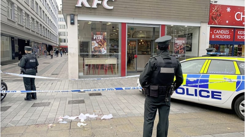 Police at the scene outside KFC in Belfast yesterday. Picture by Hugh Russell 
