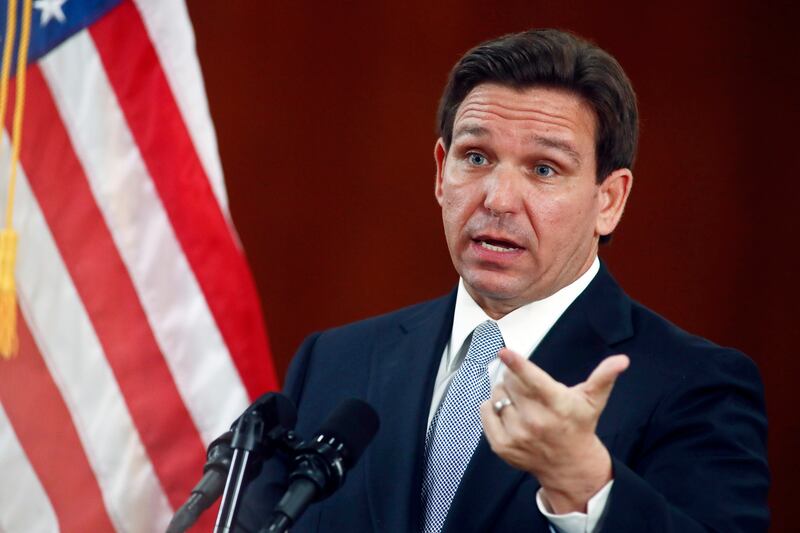 Ron DeSantis is said to have committed to helping Mr Trump as he faces Joe Biden in the election (AP)