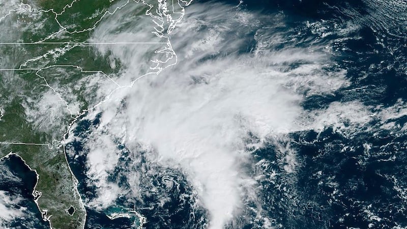 A satellite image provided by the National Oceanic and Atmospheric Administration shows a potential tropical cyclone forming off the southeastern coast of the United States in the Atlantic Ocean. (NOAA via AP)