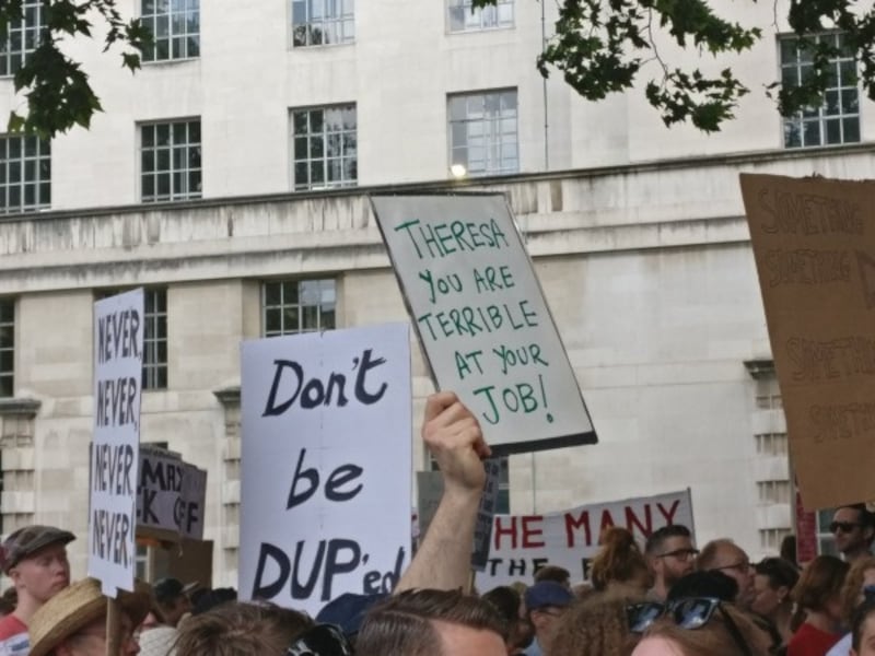 Protest signs at Theresa May Downing Street 