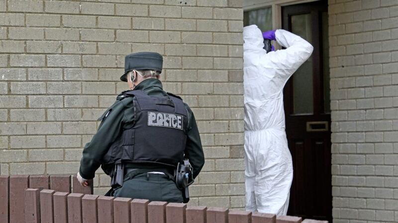 Police and forensics officers carry out investigations at a house in the Burnside area of Craigavon. Picture by Mal McCann. 