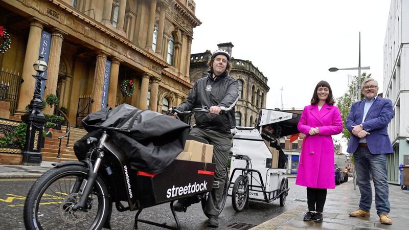 Minister Nichola Mallon helps to launch a fleet of electric delivery bikes She is pictured with (L-R) Ian Richardson, streetdock and Damien Corr, Cathedral Quarter BID 