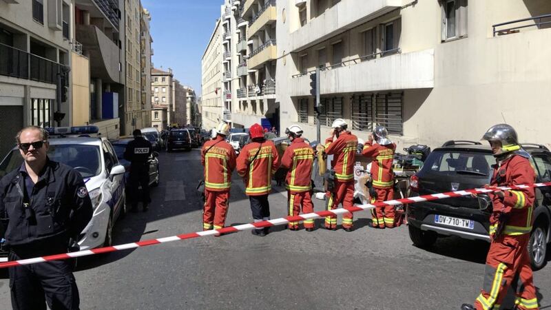 A police officer and rescue workers cordon off a street during searches in Marseille, southern France Picture by Claude Paris/AP 