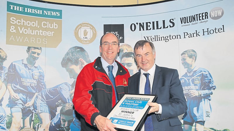 Kevin Glynn collecting the Small Club&nbsp;Award for St John&rsquo;s, Drumnaquoile, from sponsor Malachy Toner&nbsp;<br/>of Wellington Park Hotel, at The Irish News School, Club and Volunteer Awards<br />Picture by Hugh Russell