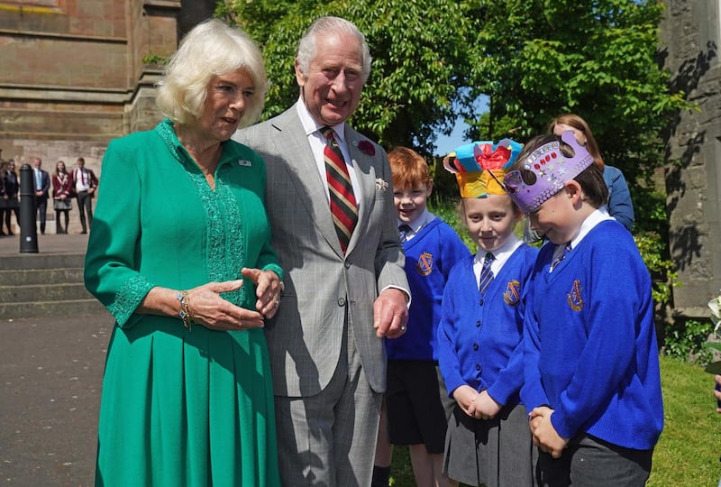 The King and Queen meet Camilla Nowawakowska and Charles Murray, both eight, from Armstrong Primary School outside St Patrick’s Cathedral in Armagh, Co Armagh
