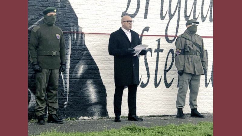 Dee Stitt unveils a mural for murdered UDA man Tommy Herron alongside masked men 