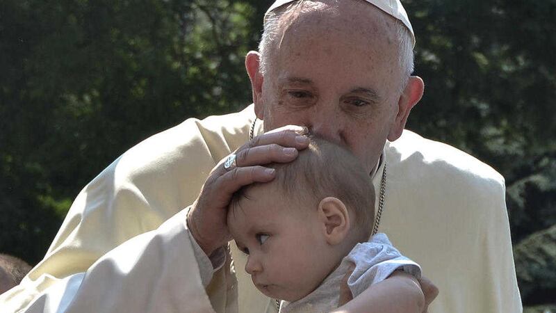 Pope Francis kisses a baby in Sarajevo earlier this year 