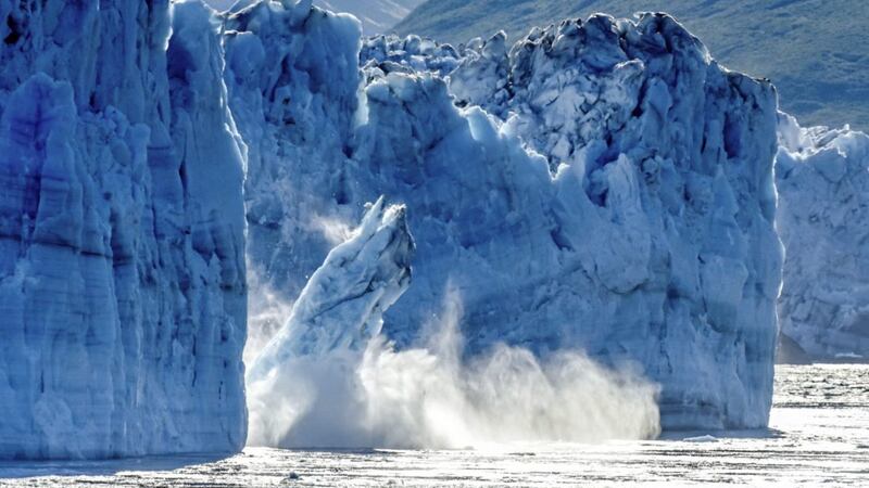 A massive piece of Hubbard glacier calves off into Disenchantment Bay, Alaska 