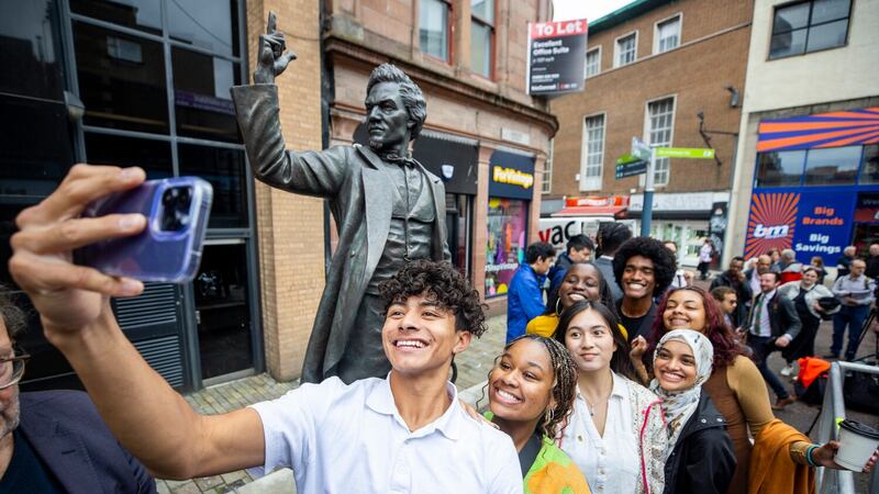 Students from the Frederick Douglass Global Fellowship at the unveiling of a statue of Frederick Douglass in Belfast city centre (Liam McBurney/PA)