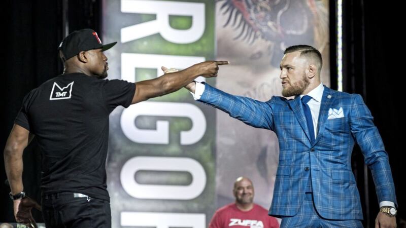 Floyd Mayweather (left) and Conor McGregor exchange harsh words during a promotional stop in Toronto on Wednesday July 12 2017, for their upcoming boxing match in Las Vegas. Picture by Christopher Katsarov/The Canadian Press via AP) 