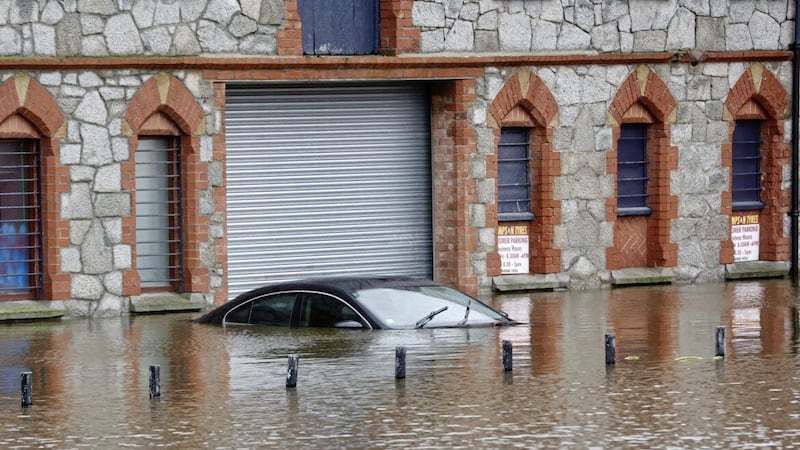 A car submerged by flood waters in Newry this week. PICTURE: MAL MCCANN 