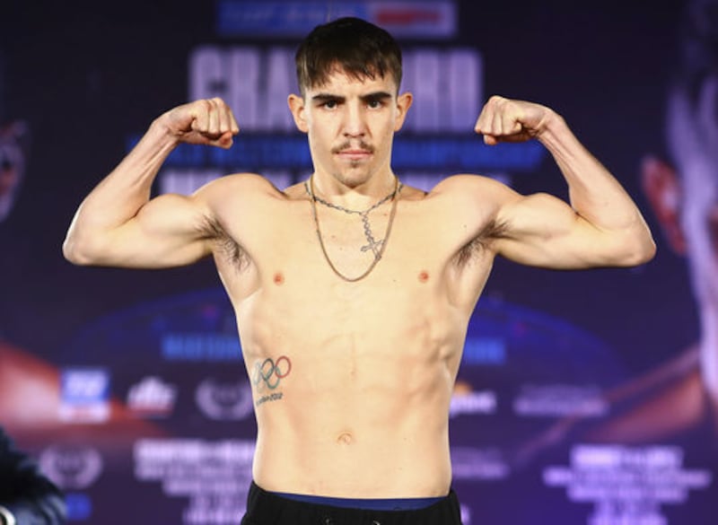 Michael Conlan flexes his muscles at the weigh-ins in New York yesterday. Picture by Mikey Williams / Top Rank