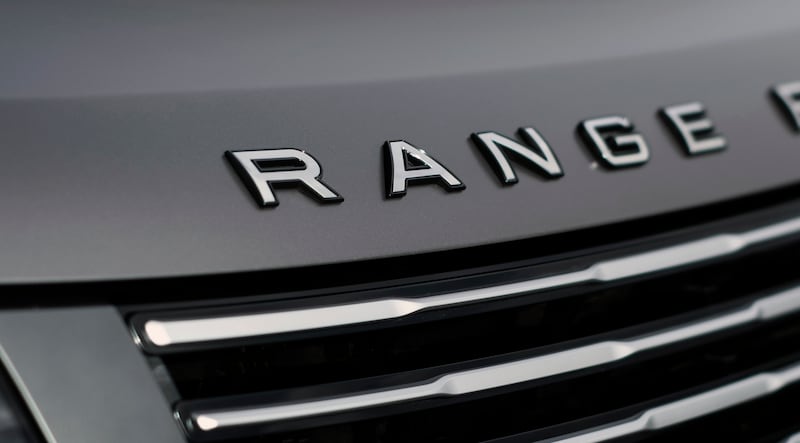 The grey exterior is contrasted by silver badges