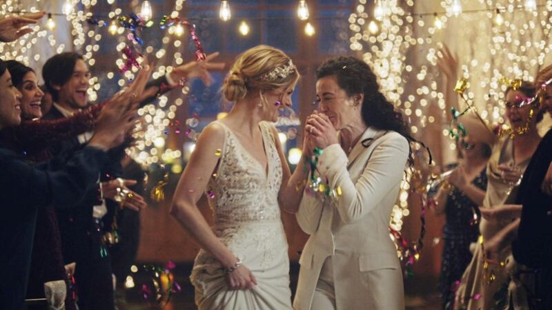 Under pressure from a conservative advocacy group, The Hallmark Channel has pulled the ads for wedding-planning website Zola that featured same-sex couples, including two brides kissing. Picture by Zola via AP 