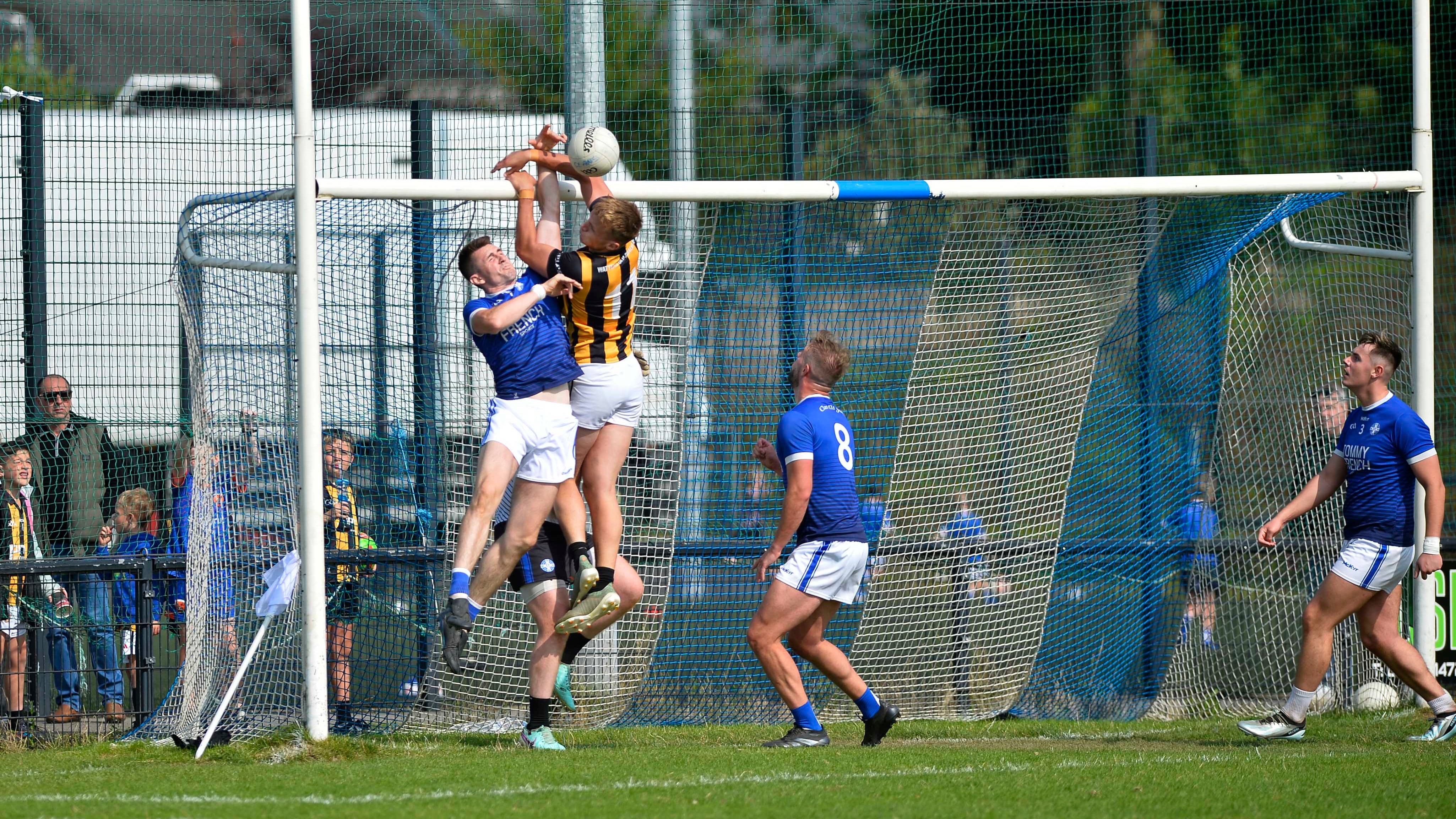 Clan Na Gael and Crossmaglen players jumping for a ball