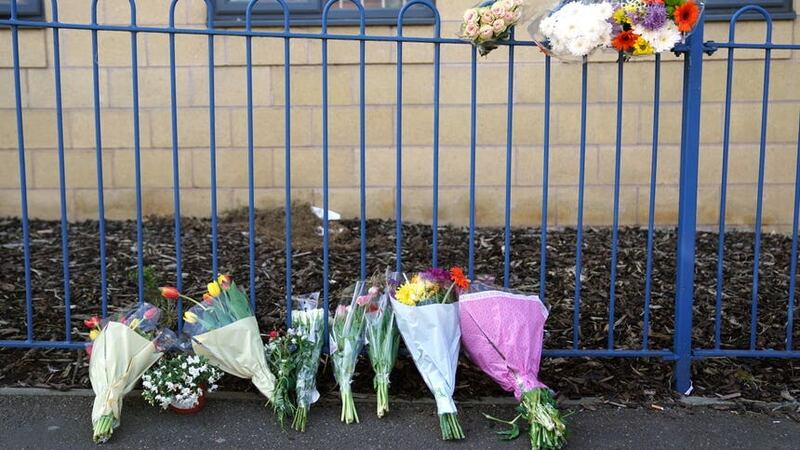 Flowers left outside a building on Ilkeston Road, Nottingham, after three people were killed and another three hurt in connected attacks on Tuesday morning (Jacob King/PA)