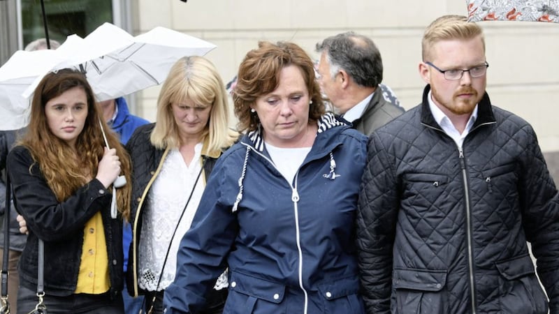 Murdered prison officer David Black&#39;s widow Yvonne (centre) leaves Belfast Crown Court 