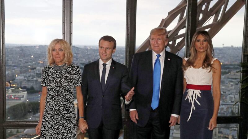 From left, Brigitte Macron with her husband Emmanuel Macron, US president Donald Trump and first lady Melania Trump at the Jules Verne restaurant before a private dinner at the Eiffel Tower in Paris on Thursday. Picture by Yves Herman, Pool Photo via Associated Press 