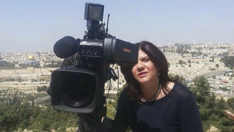 Shireen Abu Akleh, a journalist for Al Jazeera network, stands next to a TV camera in an area where the Dome of the Rock shrine at Al-Aqsa Mosque in the Old City of Jerusalem is seen at left in the background (Al Jazeera via AP)&nbsp;