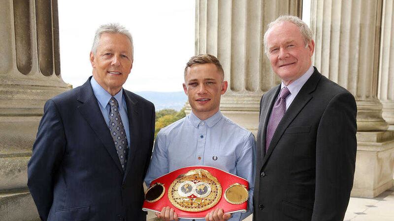 Peter Robinson and Martin McGuinness with Carl Frampton at Stormont in 2014 following his world boxing triumph 