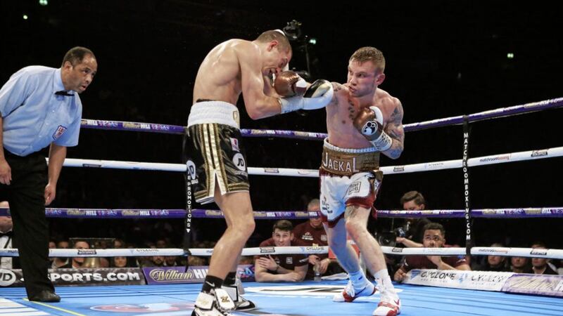 Carl Frampton (right) and Scott Quigg during their IBF &amp; WBA World Super-Bantamweight Championship bout at Manchester Arena in 2016 