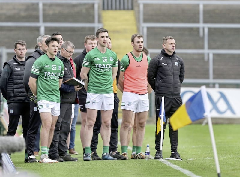 Fermanagh manager Kieran Donnelly (right) stands for the national anthem at Brewster Park, Enniskillen. Pic: Margaretr McLaughlin. 