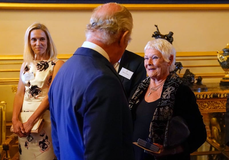 The King meets Dame Judi Dench during a reception at Windsor Castle 