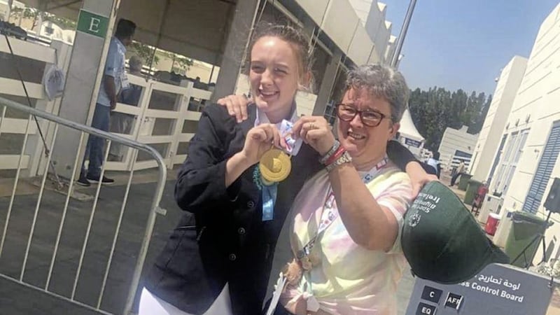 Megan McElherron from Bessbrook, with her mother Sharon and her gold medal in Abu Dhabi 
